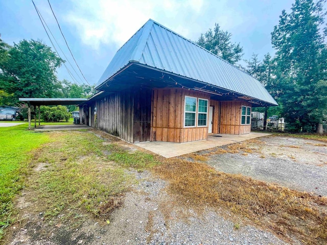 view of home's exterior with a carport