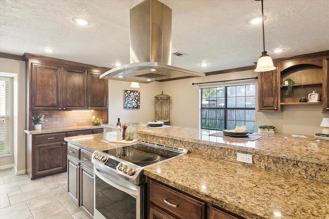 kitchen with a textured ceiling, decorative light fixtures, stainless steel electric stove, island range hood, and dark brown cabinets