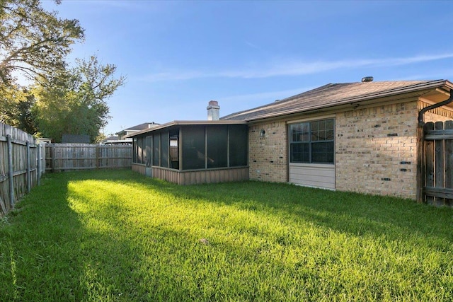 view of yard with a sunroom