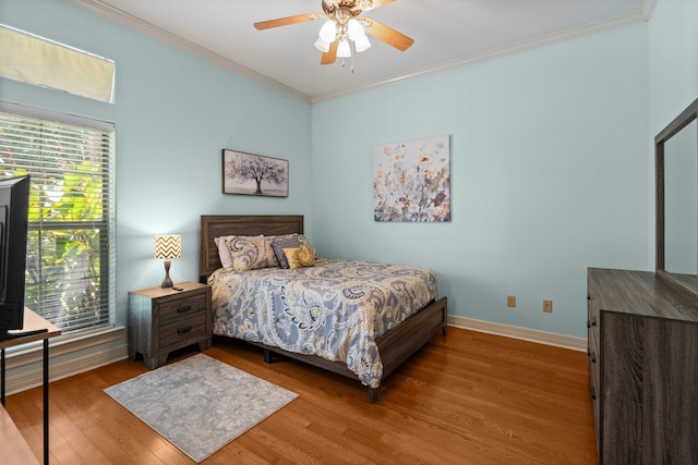 7675 Myrtle Beach Dr, Beaumont, TX 77707 - bedroom with crown molding, wood finished floors, and a ceiling fan