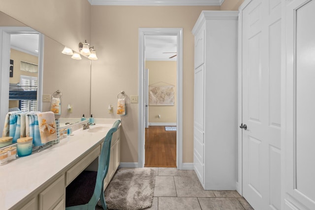 7675 Myrtle Beach Dr, Beaumont, TX 77707 - bathroom with vanity, ornamental molding, and tile patterned floors