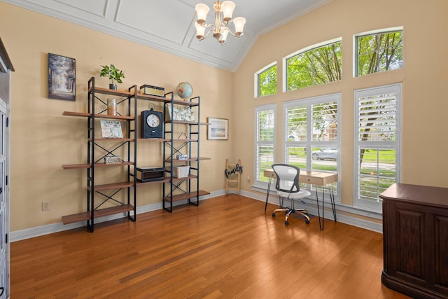 7675 Myrtle Beach Dr, Beaumont, TX 77707 - office with crown molding, healthy amount of natural light, wood finished floors, a chandelier, and vaulted ceiling