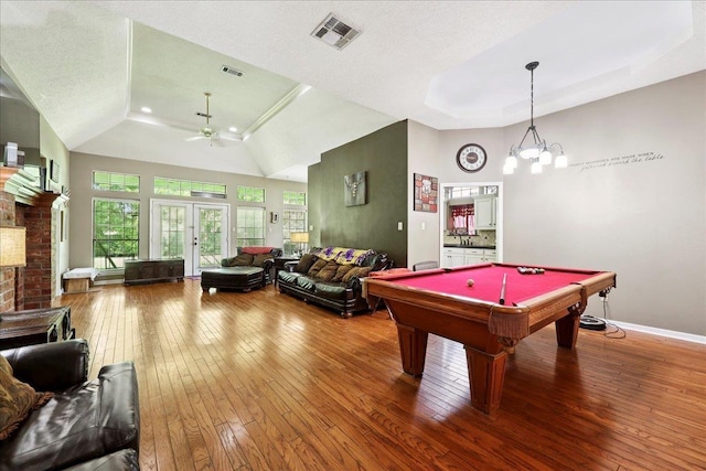 1416 23rd St, Nederland, TX 77627 - game room featuring a tray ceiling, wood-type flooring, a ceiling fan, pool table, and a towering ceiling