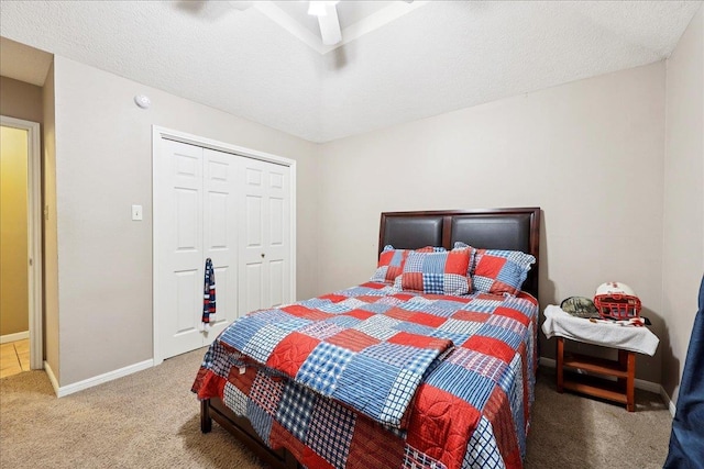 1416 23rd St, Nederland, TX 77627 - carpeted bedroom featuring a closet, ceiling fan, and a textured ceiling