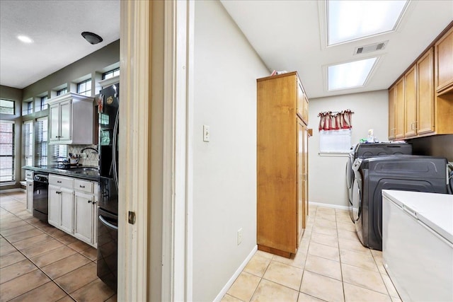 1416 23rd St, Nederland, TX 77627 - laundry room with independent washer and dryer, light tile patterned floors, and recessed lighting