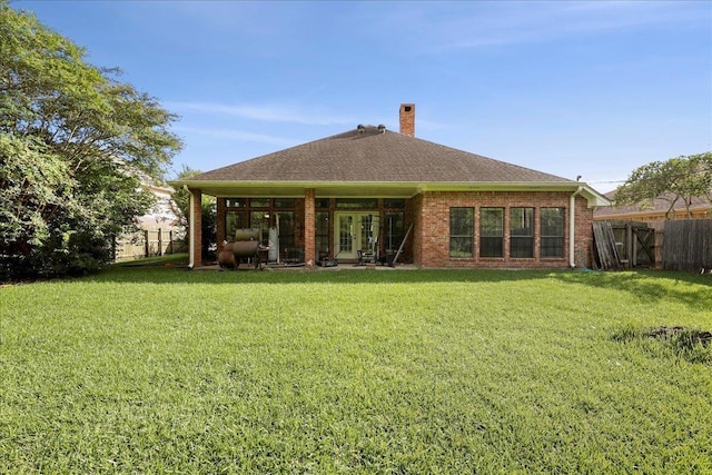 1416 23rd St, Nederland, TX 77627 - rear view of property with roof with shingles, a chimney, and brick siding