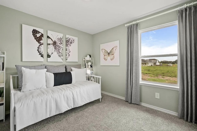 bedroom with carpet flooring and baseboards