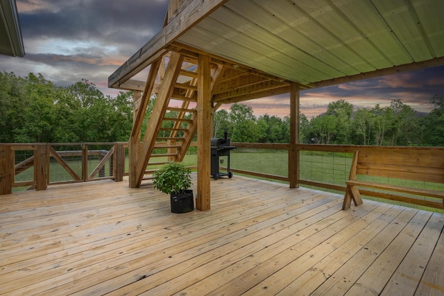 451 Lene Ln, Beaumont, TX 77705 - deck at dusk featuring stairs, a grill, and view of wooded area