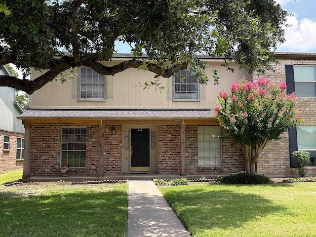 445 Longmeadow, Beaumont, TX 77707 - view of front of home with a front yard and brick siding