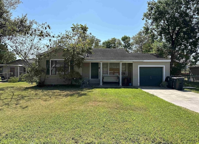 ranch-style house with a garage and a front lawn