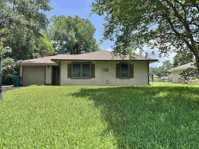 112 Dahlia St, Orange, TX 77630 - single story home with a garage and a front lawn