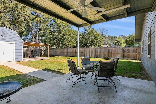 view of patio / terrace featuring ceiling fan and a storage shed