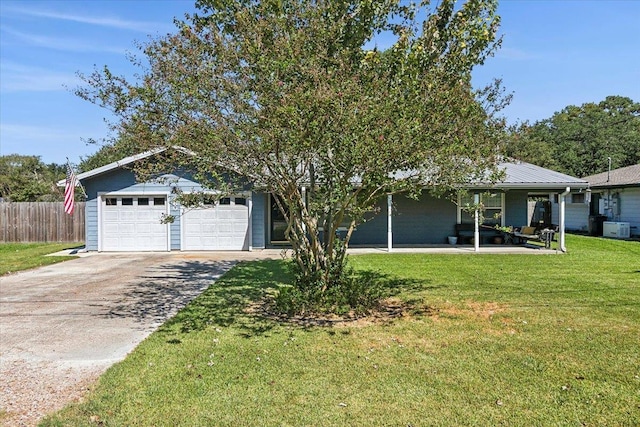 view of front of home featuring a front lawn and a garage