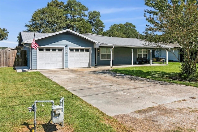 ranch-style home featuring a garage and a front lawn