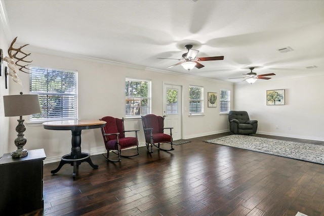 living area with ornamental molding and dark wood-type flooring