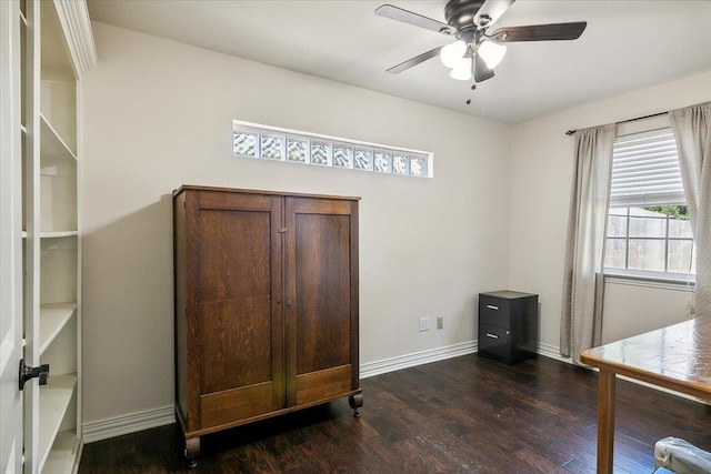 home office with ceiling fan and dark wood-type flooring