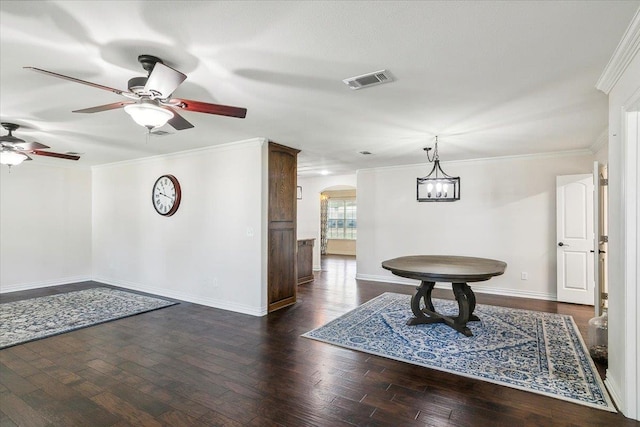 interior space with dark hardwood / wood-style floors, ceiling fan, and crown molding