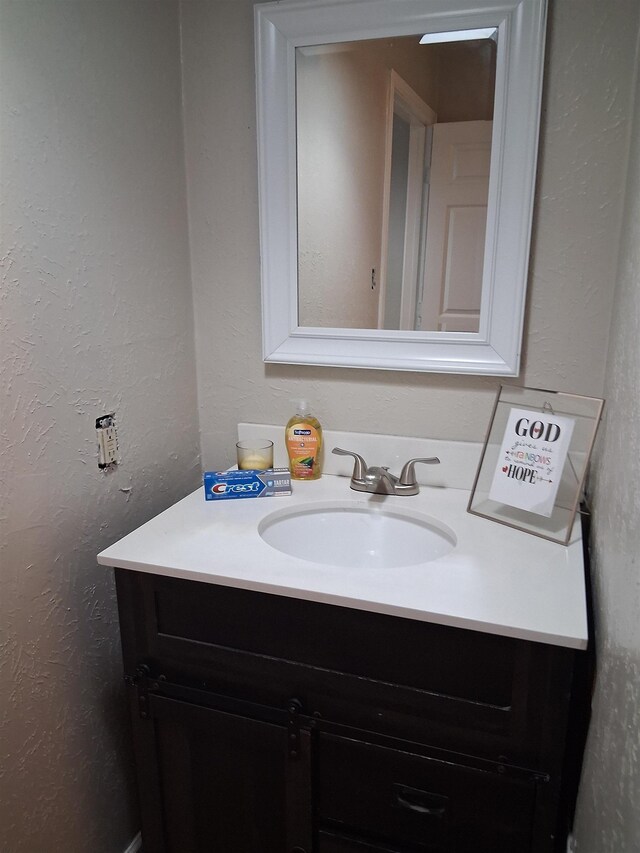 5330 Landry Ln, Beaumont, TX 77708 - bathroom featuring vanity and a textured wall