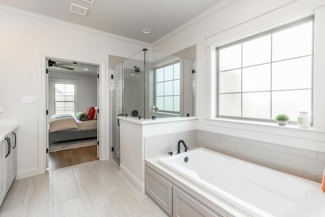 bathroom with independent shower and bath, crown molding, and vanity