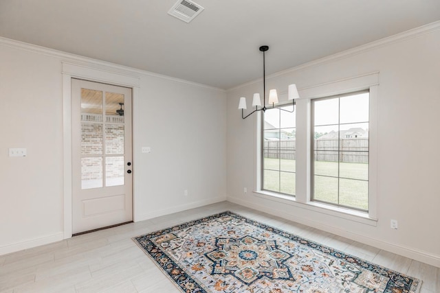 dining room with an inviting chandelier and crown molding