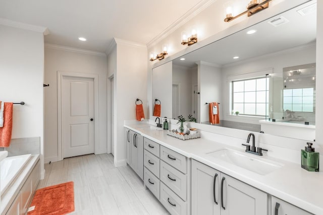 bathroom featuring vanity, a bath, and crown molding