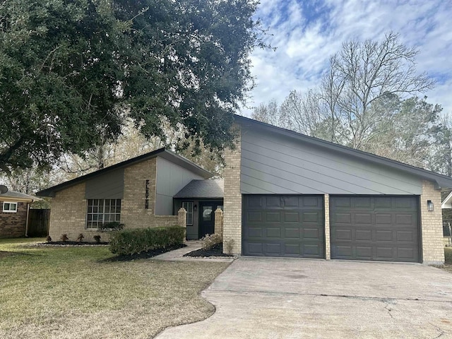 ranch-style house featuring a garage and a front lawn