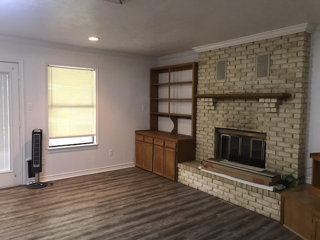 unfurnished living room featuring crown molding, dark wood-style flooring, and a fireplace