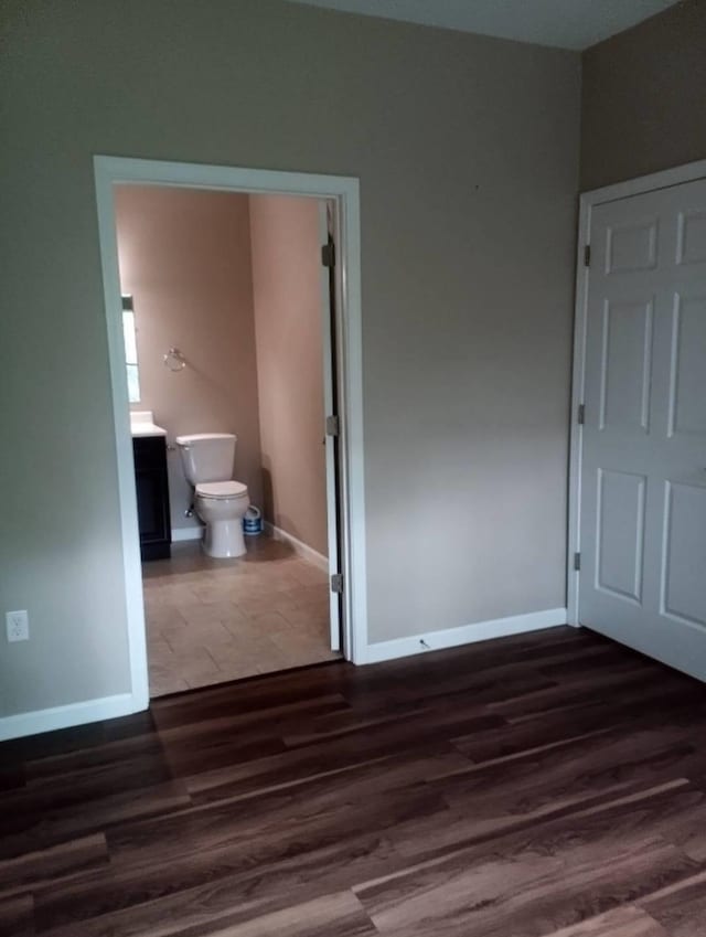 unfurnished room with dark hardwood / wood-style floors