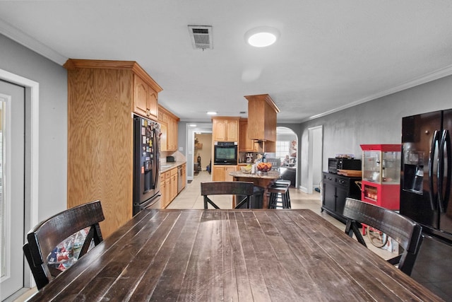 interior space featuring crown molding, arched walkways, and visible vents