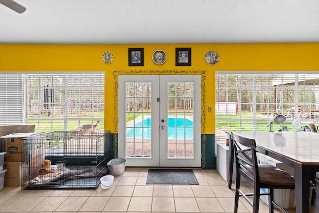 doorway to outside featuring french doors and tile patterned flooring