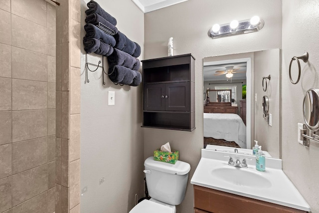 full bathroom with vanity, ensuite bath, toilet, and a ceiling fan