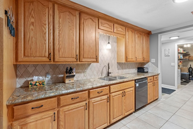 kitchen with a sink, light stone counters, stainless steel dishwasher, tasteful backsplash, and light tile patterned flooring