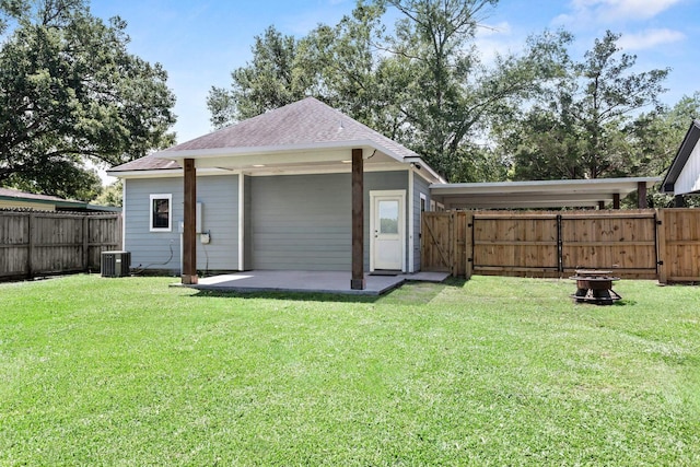 4450 W Brown St, Orange, TX 77630 - view of outdoor structure featuring cooling unit, a gate, and an outdoor fire pit