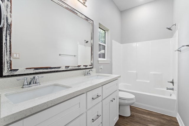 4450 W Brown St, Orange, TX 77630 - bathroom featuring toilet, double vanity, wood finished floors, and shower / washtub combination