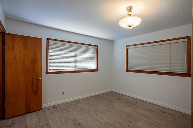 unfurnished room featuring light wood-type flooring