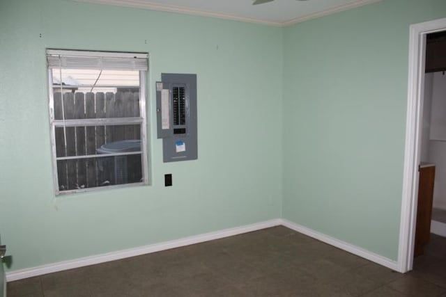 empty room with electric panel, crown molding, and ceiling fan