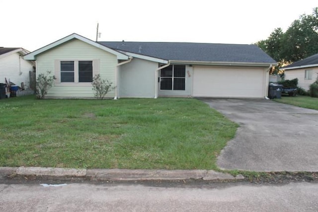 ranch-style home with a garage and a front yard