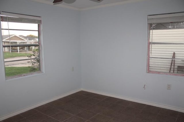 empty room featuring crown molding and ceiling fan