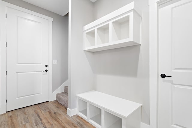 mudroom with light wood-type flooring and baseboards