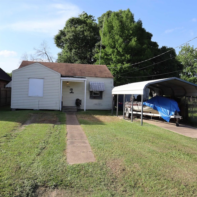 2134 Armstrong Ave, Port Neches, TX 77651 - bungalow featuring a detached carport, a front lawn, and roof with shingles