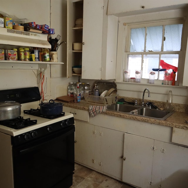 2134 Armstrong Ave, Port Neches, TX 77651 - kitchen featuring range with gas cooktop, a sink, open shelves, white cabinets, and light countertops