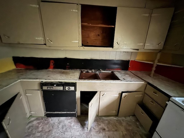 kitchen with a sink, white cabinetry, light countertops, dishwasher, and white range