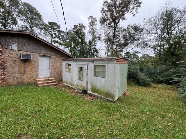 1506 Hopkins, Jasper, TX 75951 - view of shed featuring a wall unit AC