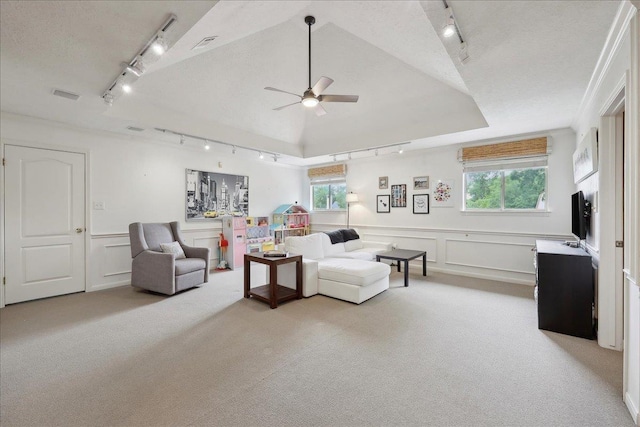 4820 Ashland St, Beaumont, TX 77706 - living room with track lighting, visible vents, a decorative wall, light colored carpet, and ceiling fan