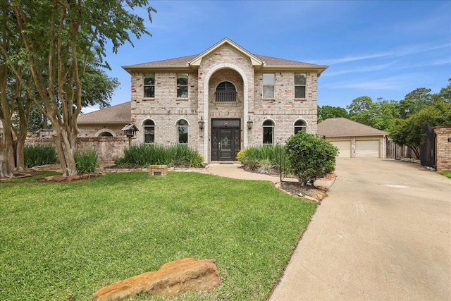 4820 Ashland St, Beaumont, TX 77706 - view of front of property with concrete driveway, brick siding, and a front yard