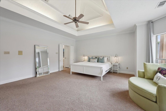 4820 Ashland St, Beaumont, TX 77706 - carpeted bedroom featuring a tray ceiling, baseboards, visible vents, ceiling fan, and ornamental molding