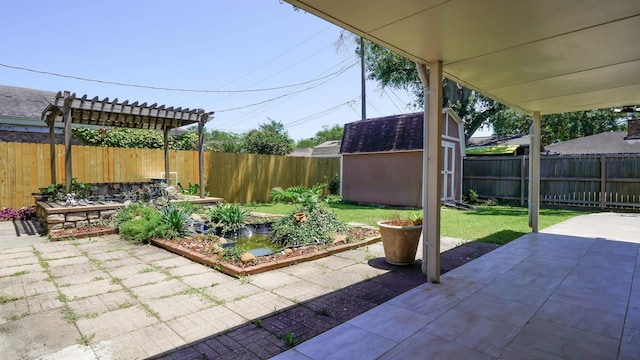 view of patio / terrace with a fenced backyard, an outdoor structure, and a shed