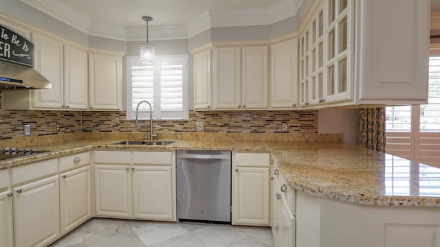 kitchen with a wealth of natural light, stainless steel dishwasher, tasteful backsplash, and a sink
