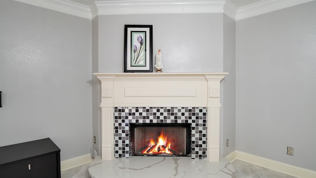 room details featuring a fireplace, crown molding, and baseboards