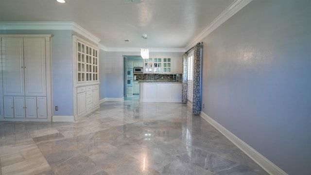 interior space featuring ornamental molding, baseboards, and marble finish floor